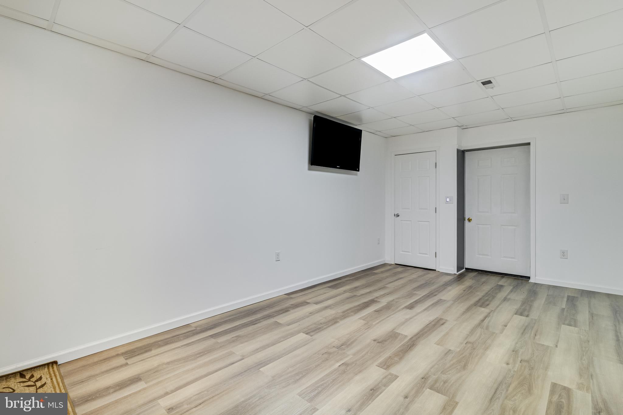 12015 Woodbury Road Nanjemoy, MD 20662 - Photo 41 of 53 a view of empty room with wooden floor