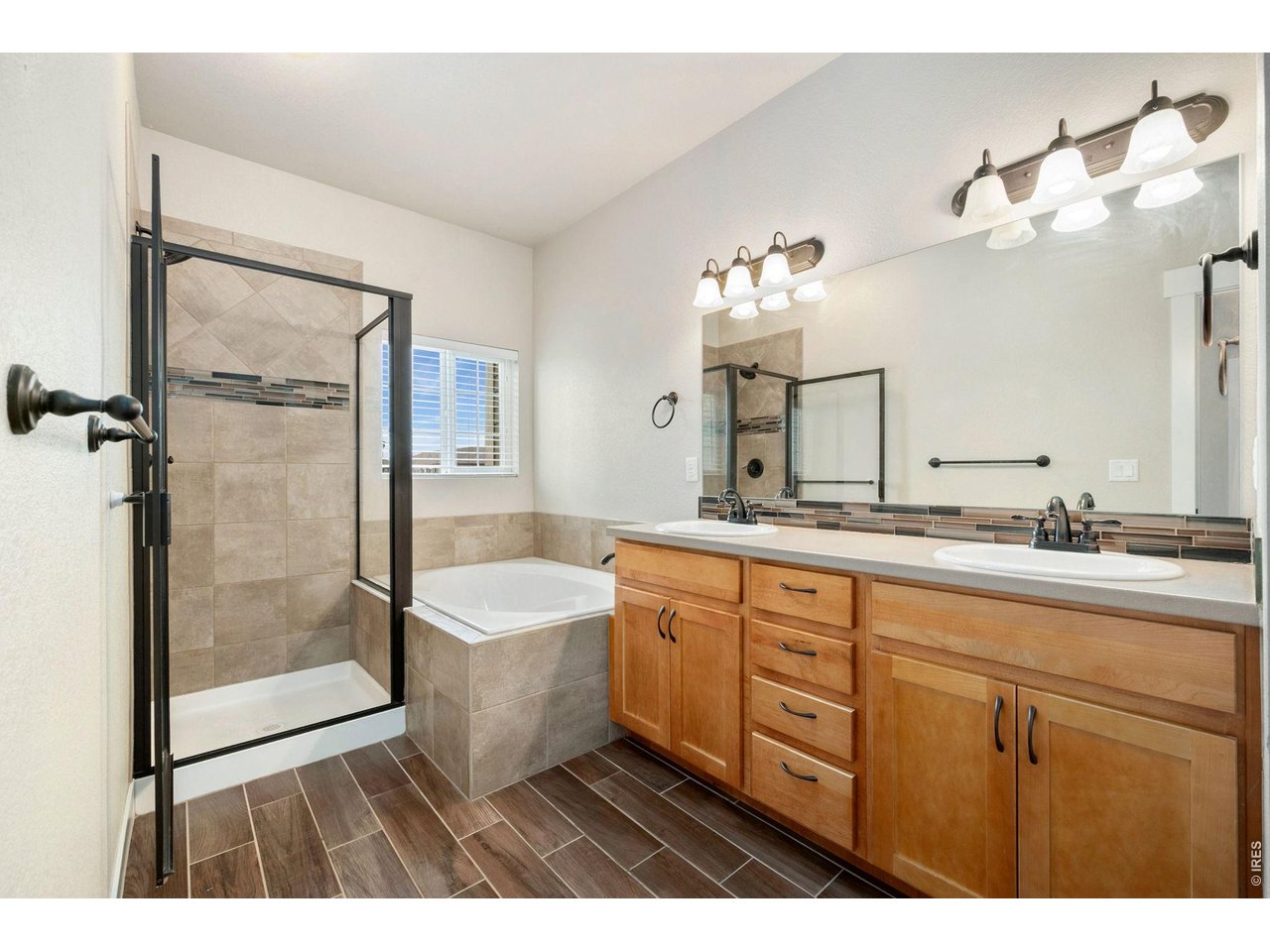 3902 Precision Drive, Unit D Fort Collins, CO 80528 - Photo 17 of 25 5 Piece Primary Bathroom features double vanity, tiled shower and soaking tub