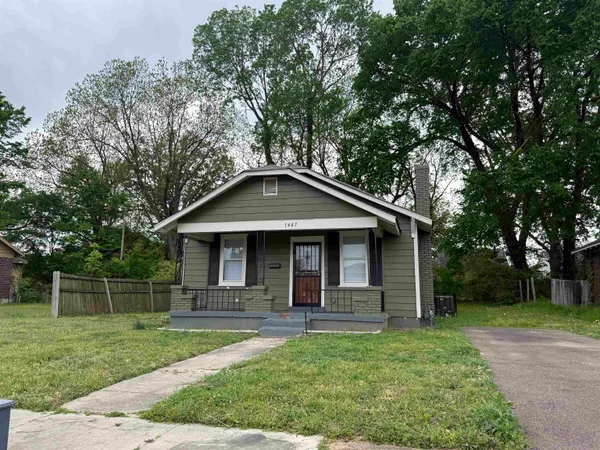 a front view of a house with yard