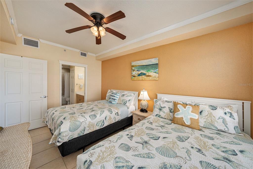 13999 Gulf Boulevard, Unit 406 St. Petersburg, FL 33708 - Photo 18 of 35 a bedroom with a bed and window