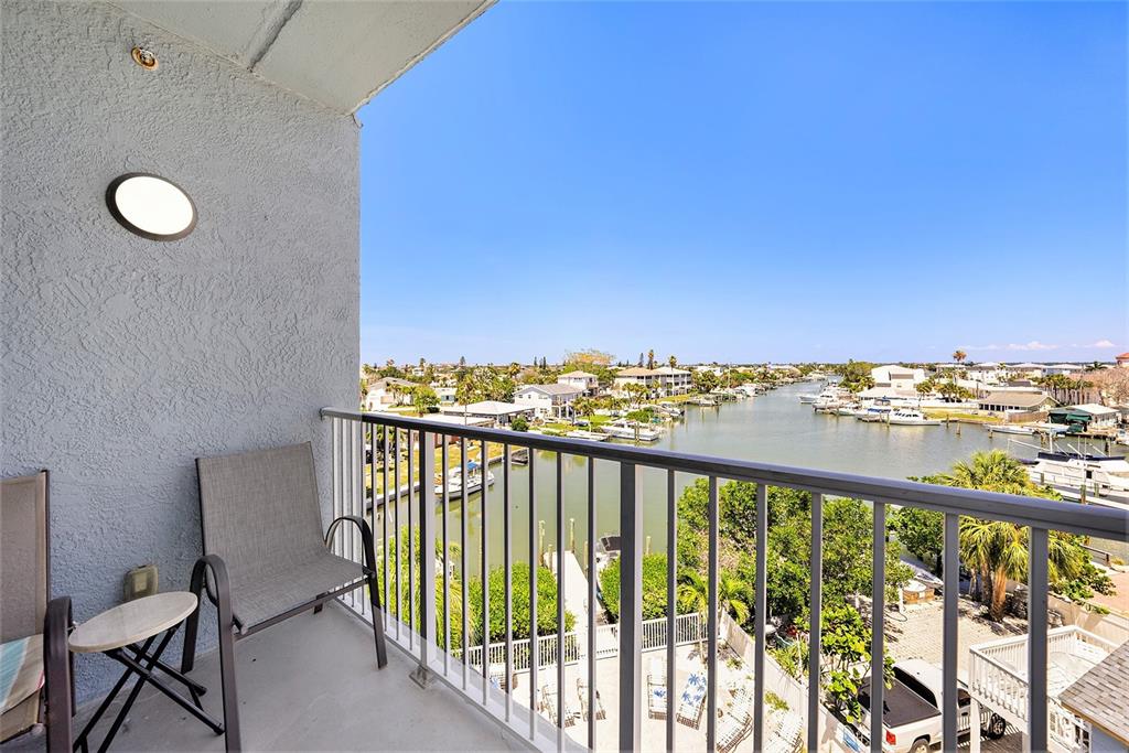 13999 Gulf Boulevard, Unit 406 St. Petersburg, FL 33708 - Photo 22 of 35 a view of a balcony with chairs