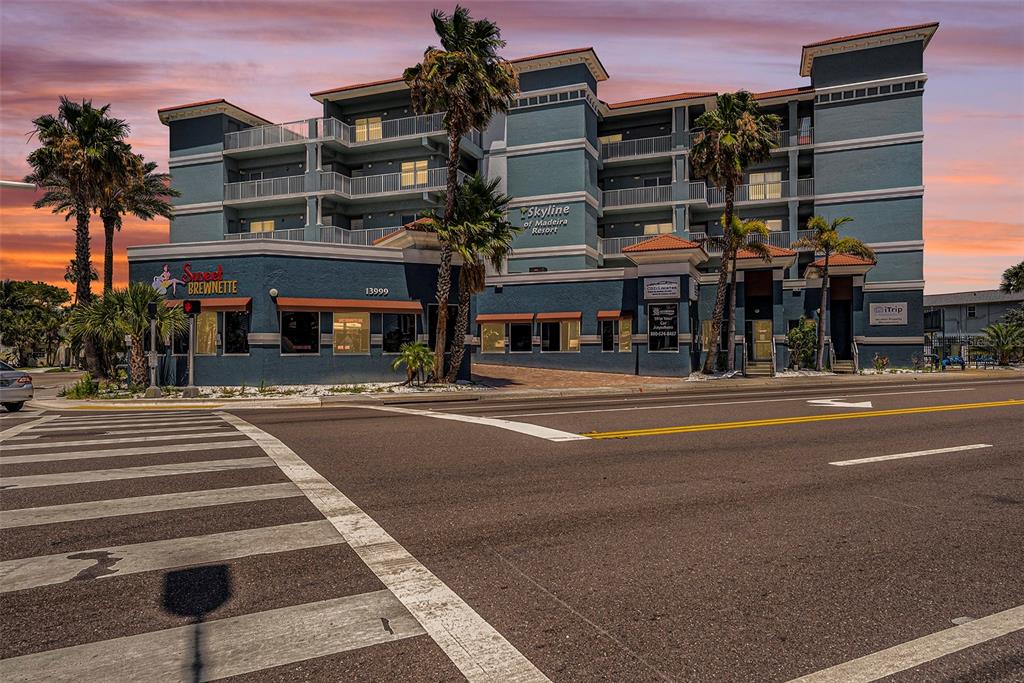 13999 Gulf Boulevard, Unit 406 St. Petersburg, FL 33708 - Photo 25 of 35 front view of a building with a street