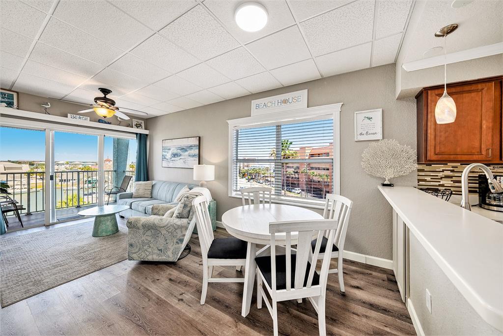 13999 Gulf Boulevard, Unit 406 St. Petersburg, FL 33708 - Photo 7 of 35 a view of a dining room with furniture