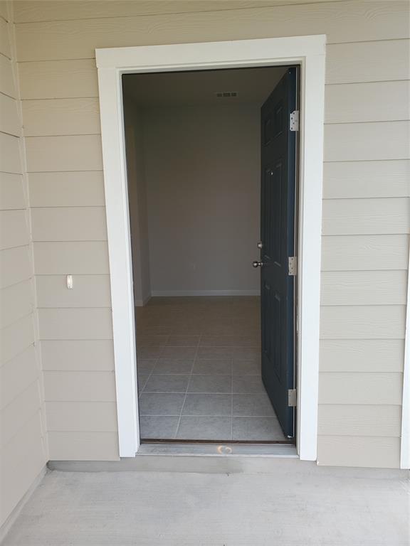 6404 Gunflint Drive Austin, TX 78747 - Photo 10 of 21 A welcoming entry invites you into a well-appointed interior, showcasing sleek tile flooring.