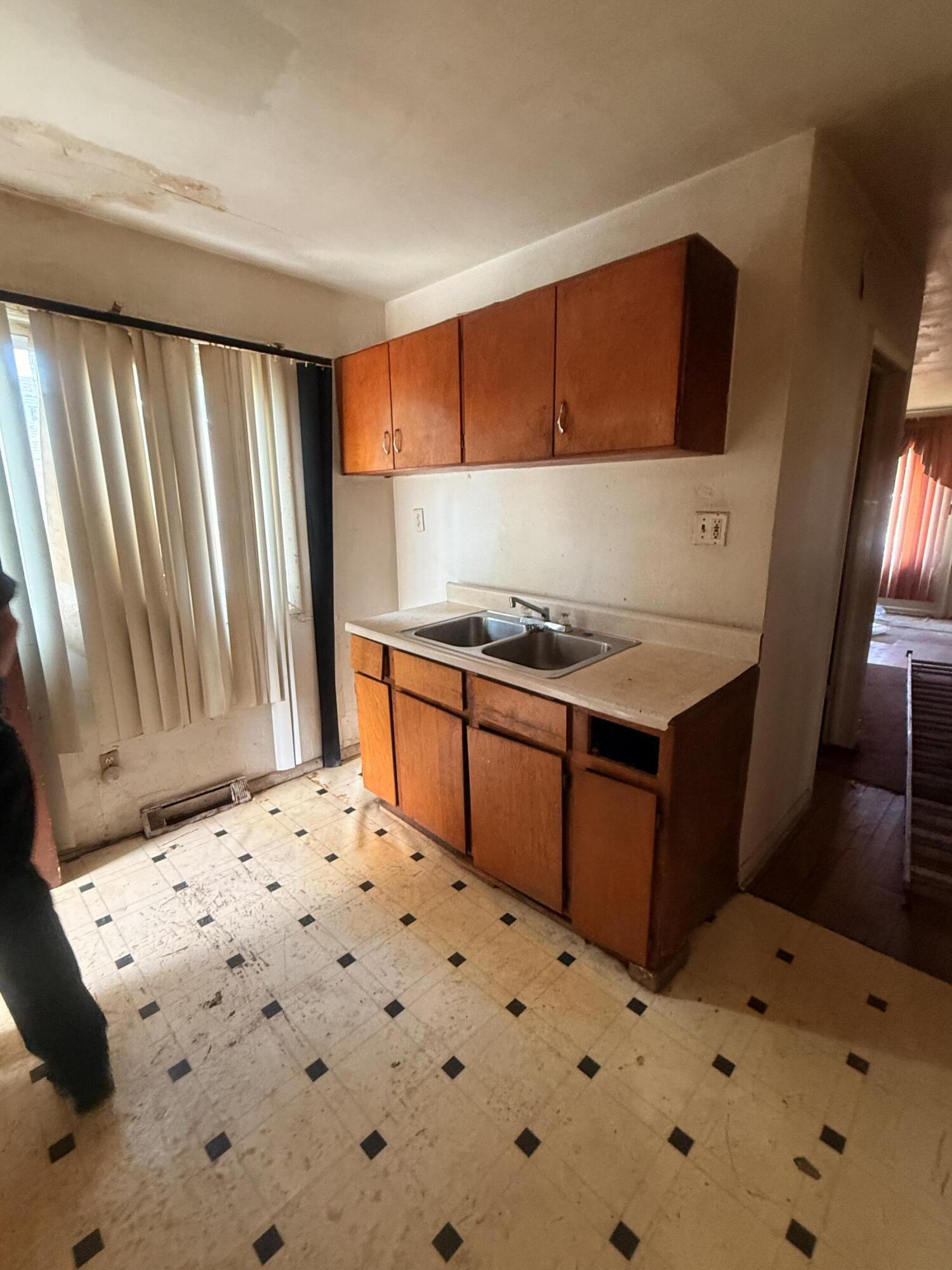 2401 Fillmore Street Gary, IN 46407 - Photo 2 of 5 a bedroom with a bed and a dresser in it