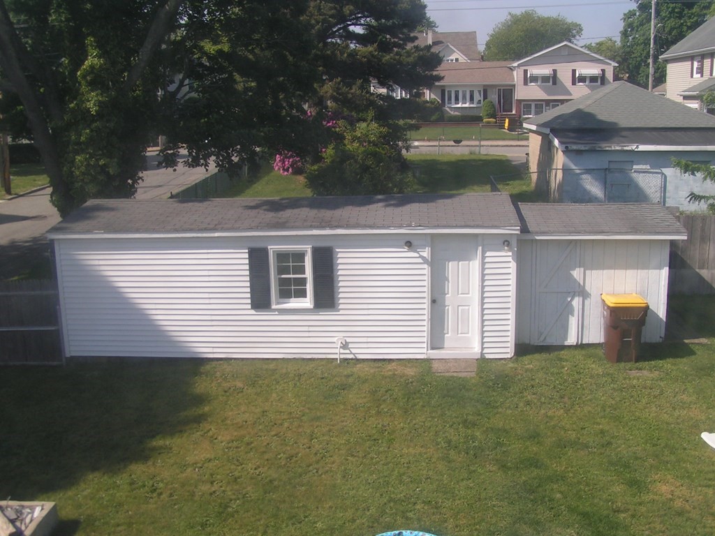 262 Anthony Street Fall River, MA 02721 - Photo 15 of 21 a front view of a house with a garden and yard