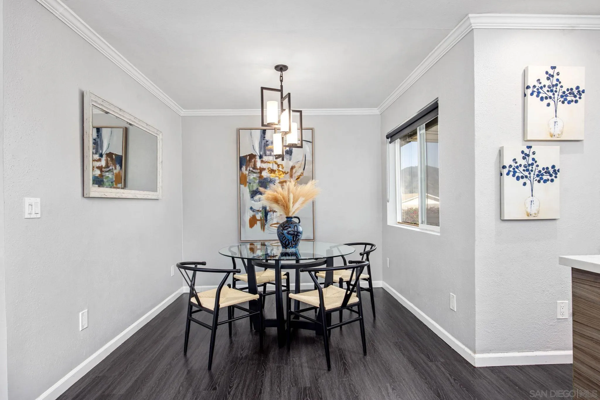 1311 Ramona Avenue Spring Valley, CA 91977 - Photo 11 of 33 a view of a dining room with furniture window and wooden floor
