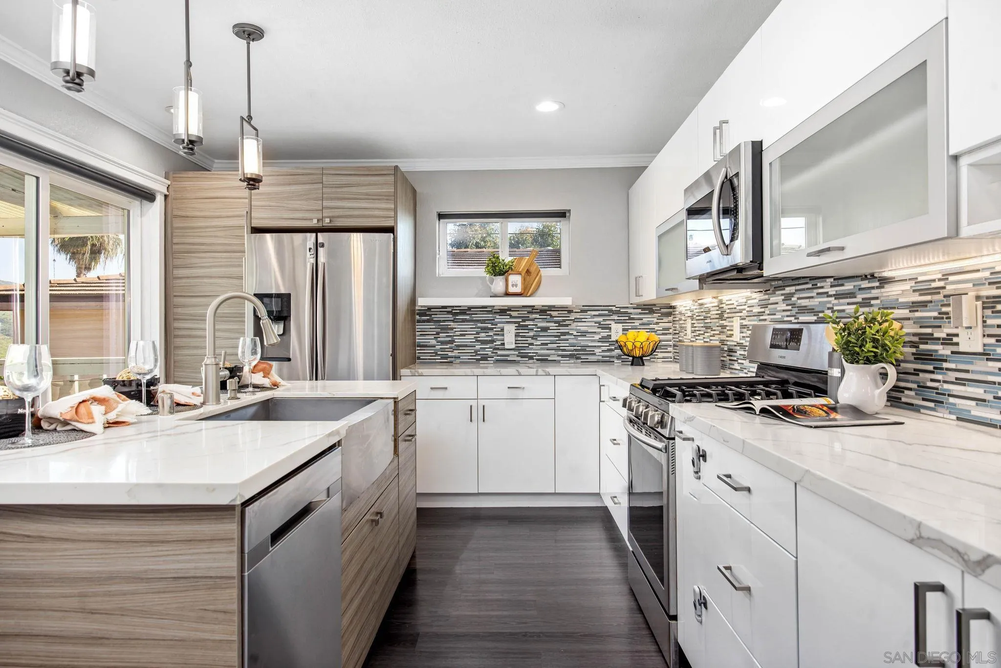 1311 Ramona Avenue Spring Valley, CA 91977 - Photo 2 of 33 a kitchen with a sink stove and cabinets
