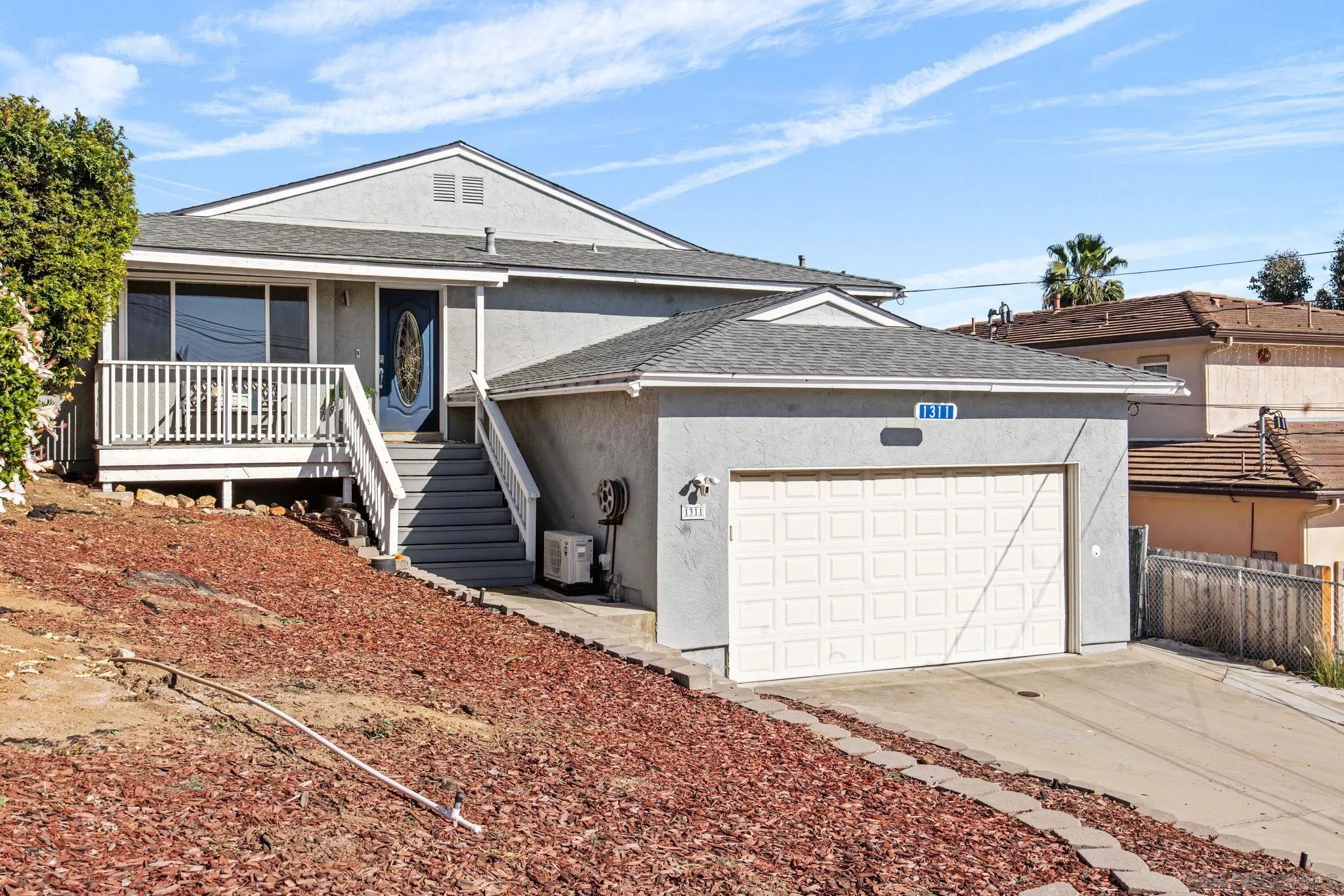 1311 Ramona Avenue Spring Valley, CA 91977 - Photo 29 of 33 a front view of a house with a garage