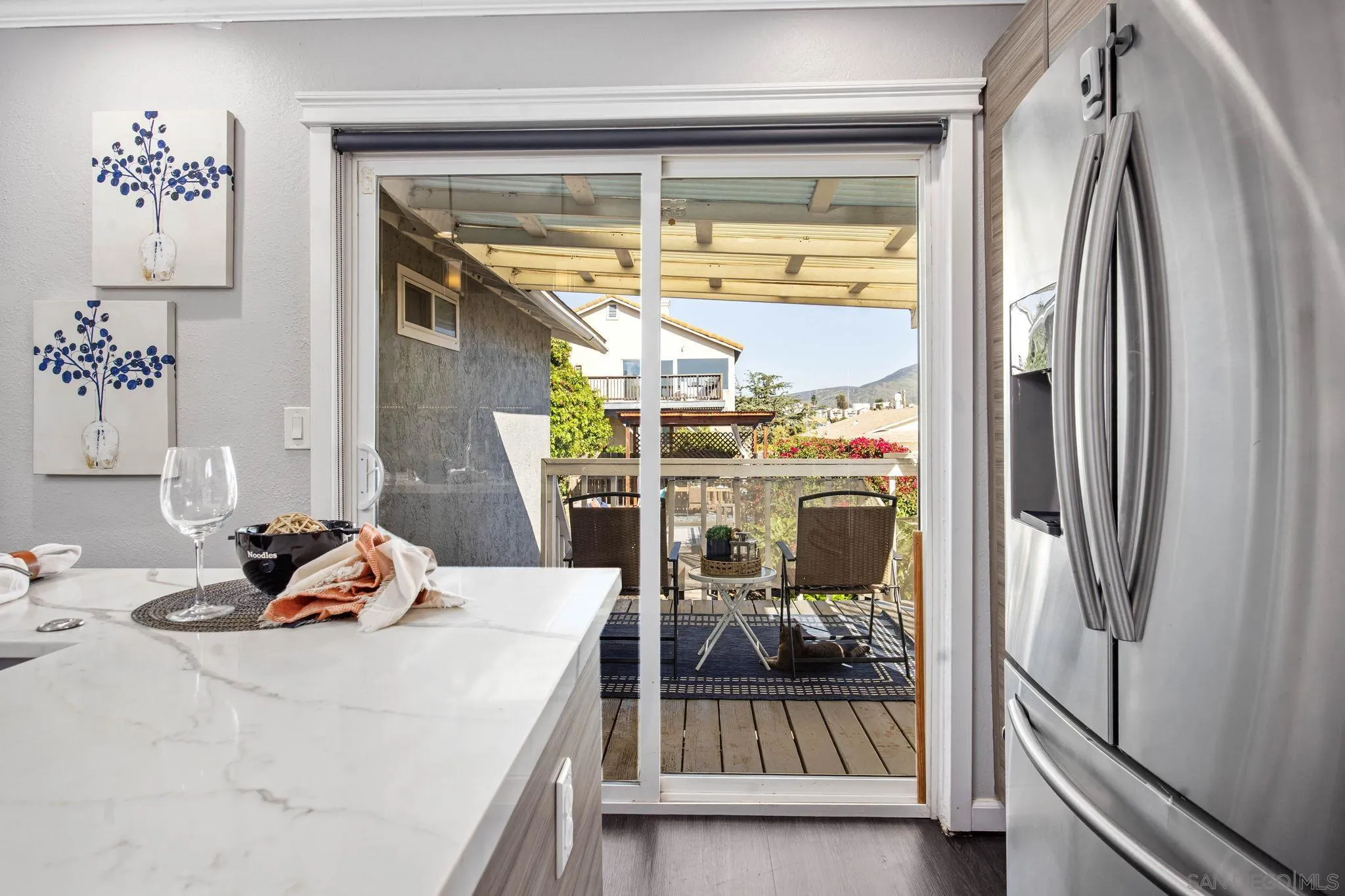 1311 Ramona Avenue Spring Valley, CA 91977 - Photo 7 of 33 a bedroom with a bed and glass door