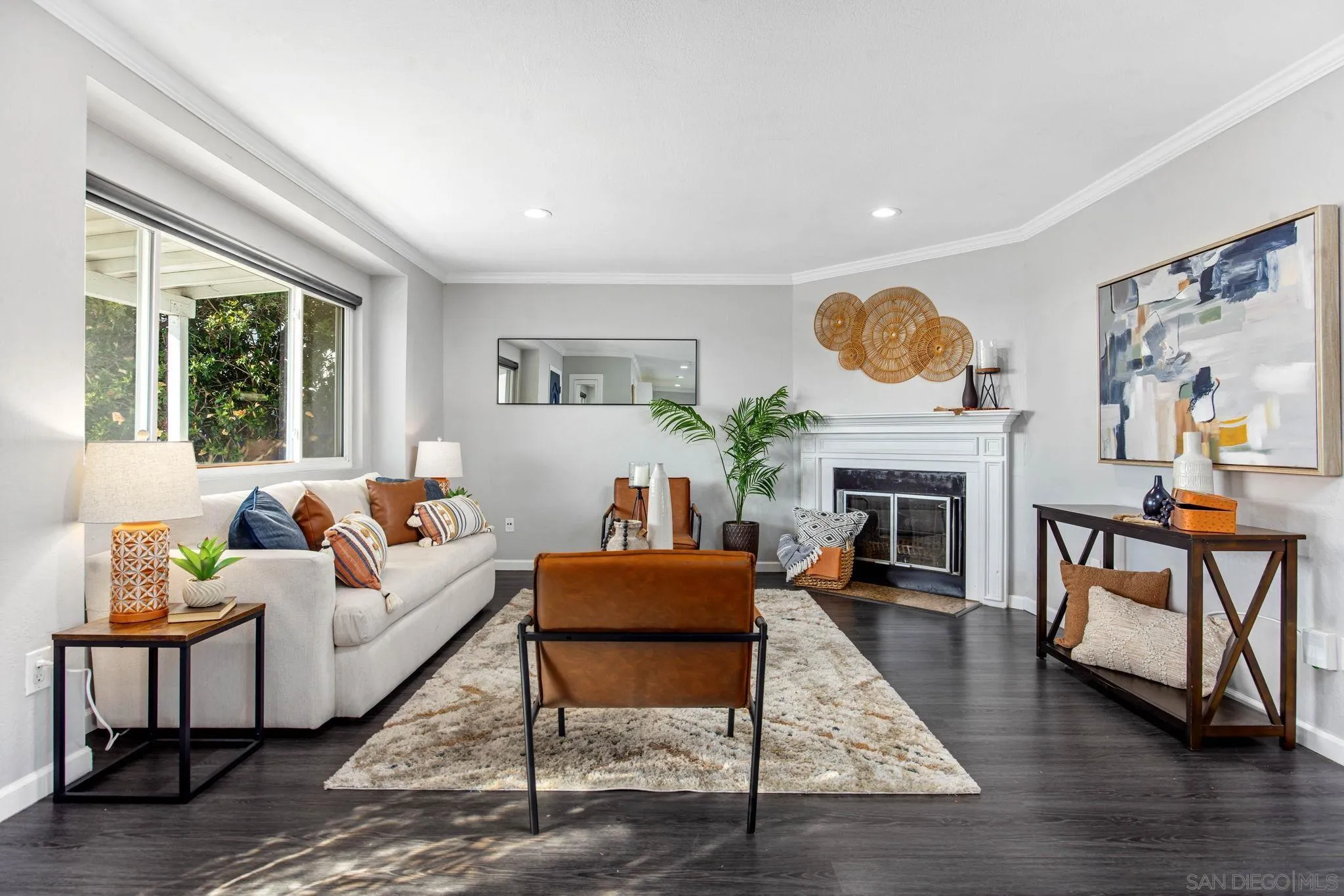 1311 Ramona Avenue Spring Valley, CA 91977 - Photo 8 of 33 a living room with furniture a fireplace and a table