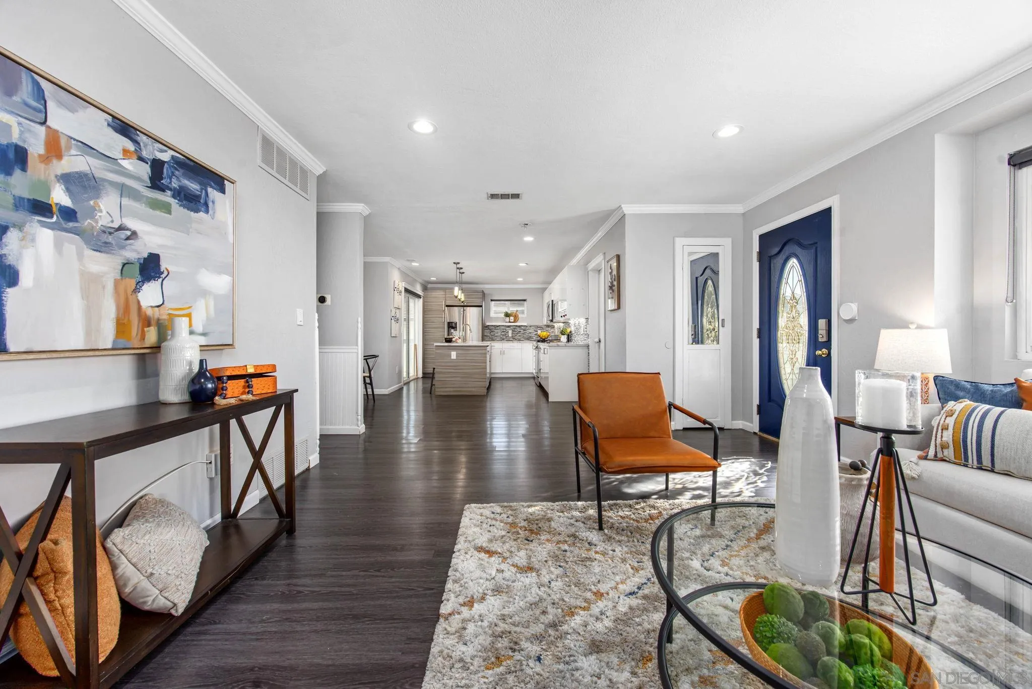 1311 Ramona Avenue Spring Valley, CA 91977 - Photo 9 of 33 a living room with furniture and wooden floor