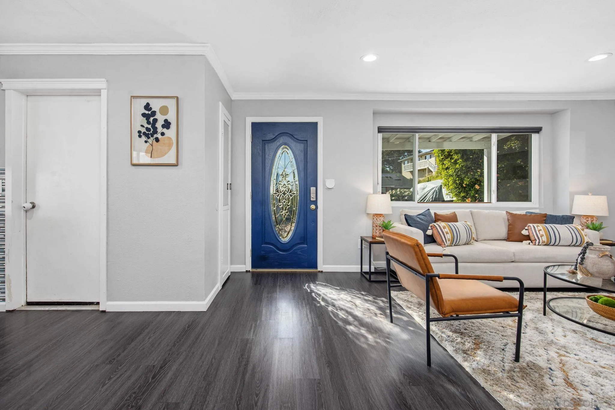 1311 Ramona Avenue Spring Valley, CA 91977 - Photo 10 of 33 a living room with furniture and a window