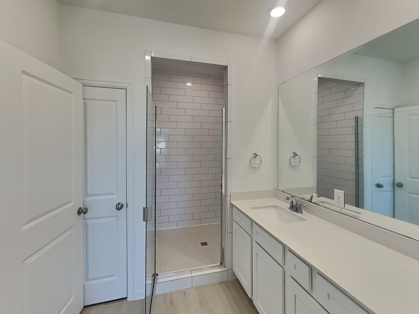 4026 Champlain Way Iowa Colony, TX 77583 - Photo 11 of 17 a bathroom with a shower sink and mirror