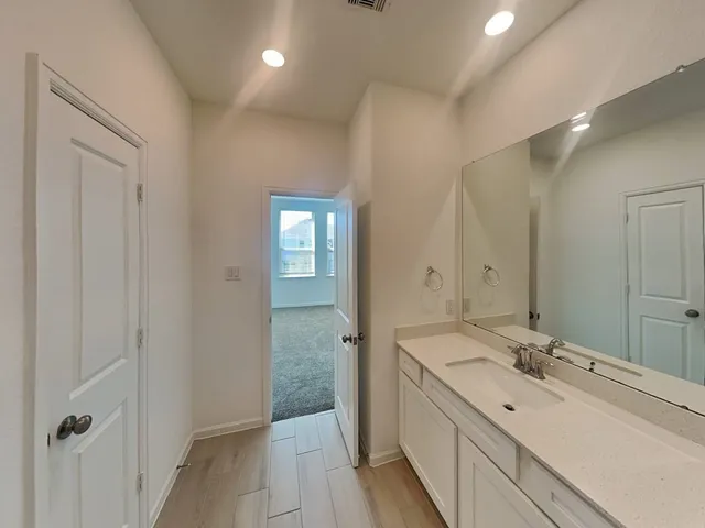 a bathroom with a toilet a sink and shower