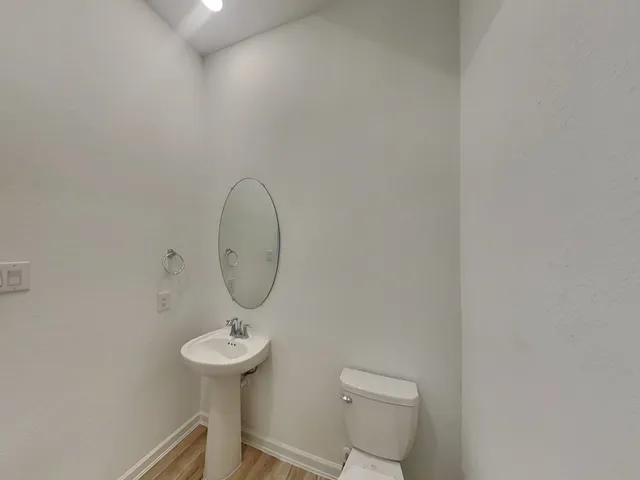 a view of an empty room and closet area