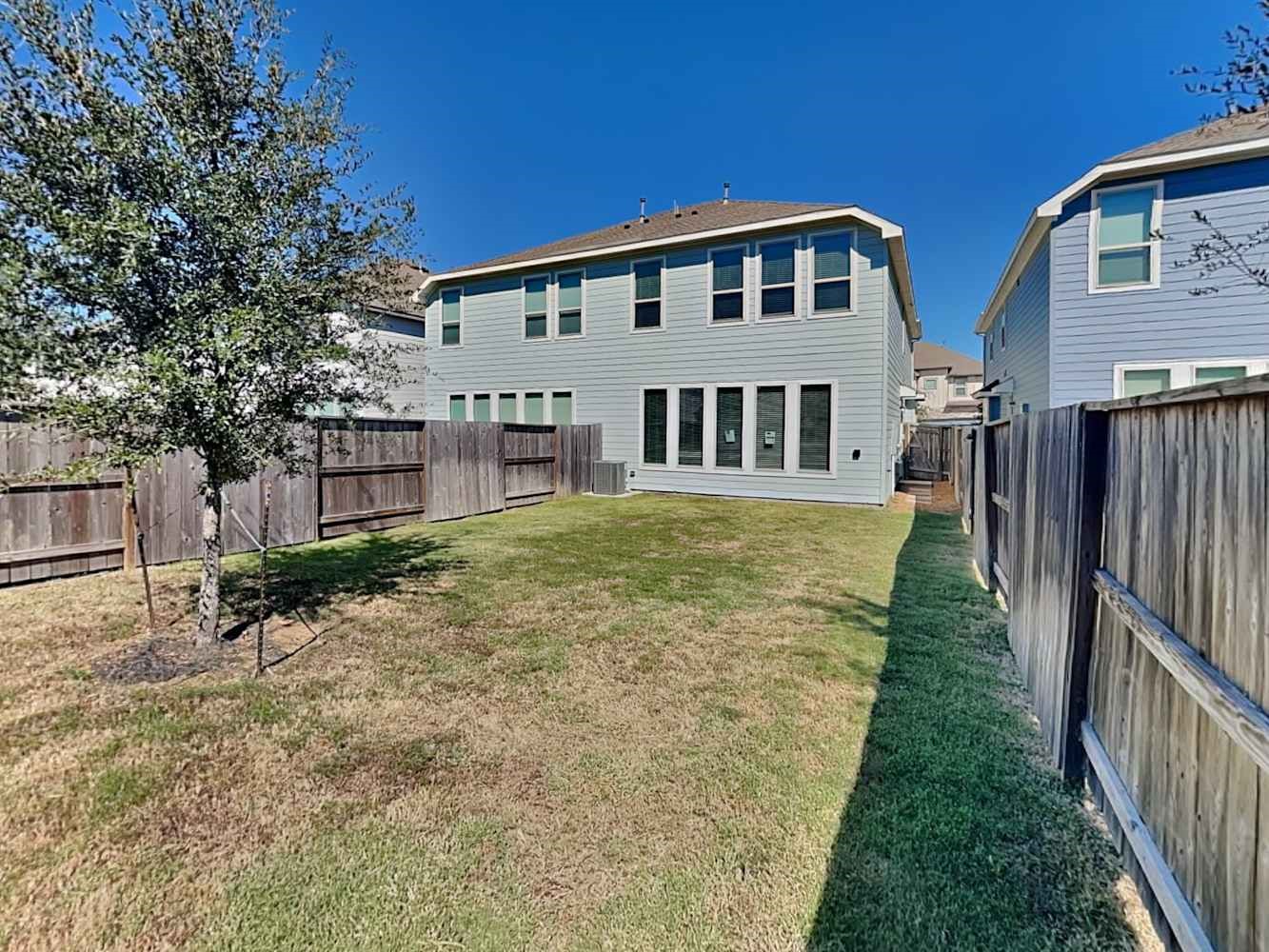 4026 Champlain Way Iowa Colony, TX 77583 - Photo 17 of 17 a view of a house with a yard