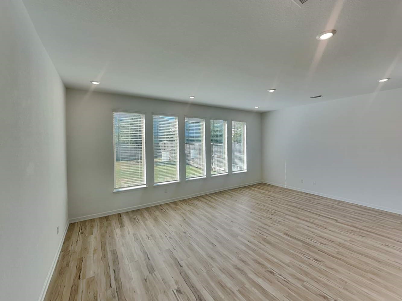 4026 Champlain Way Iowa Colony, TX 77583 - Photo 4 of 17 wooden floor in an empty room with a window