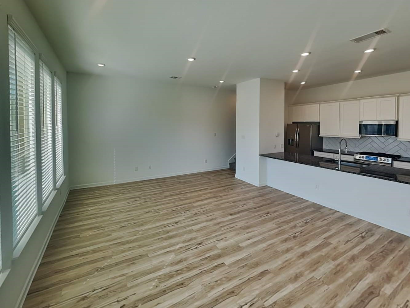 4026 Champlain Way Iowa Colony, TX 77583 - Photo 6 of 17 a view of kitchen with granite countertop cabinets and outdoor view