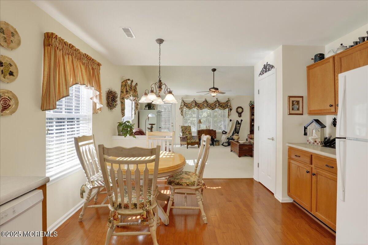 54 Merion Lane Jackson, NJ 08527 - Photo 12 of 46 a view of a dining room with furniture and a chandelier