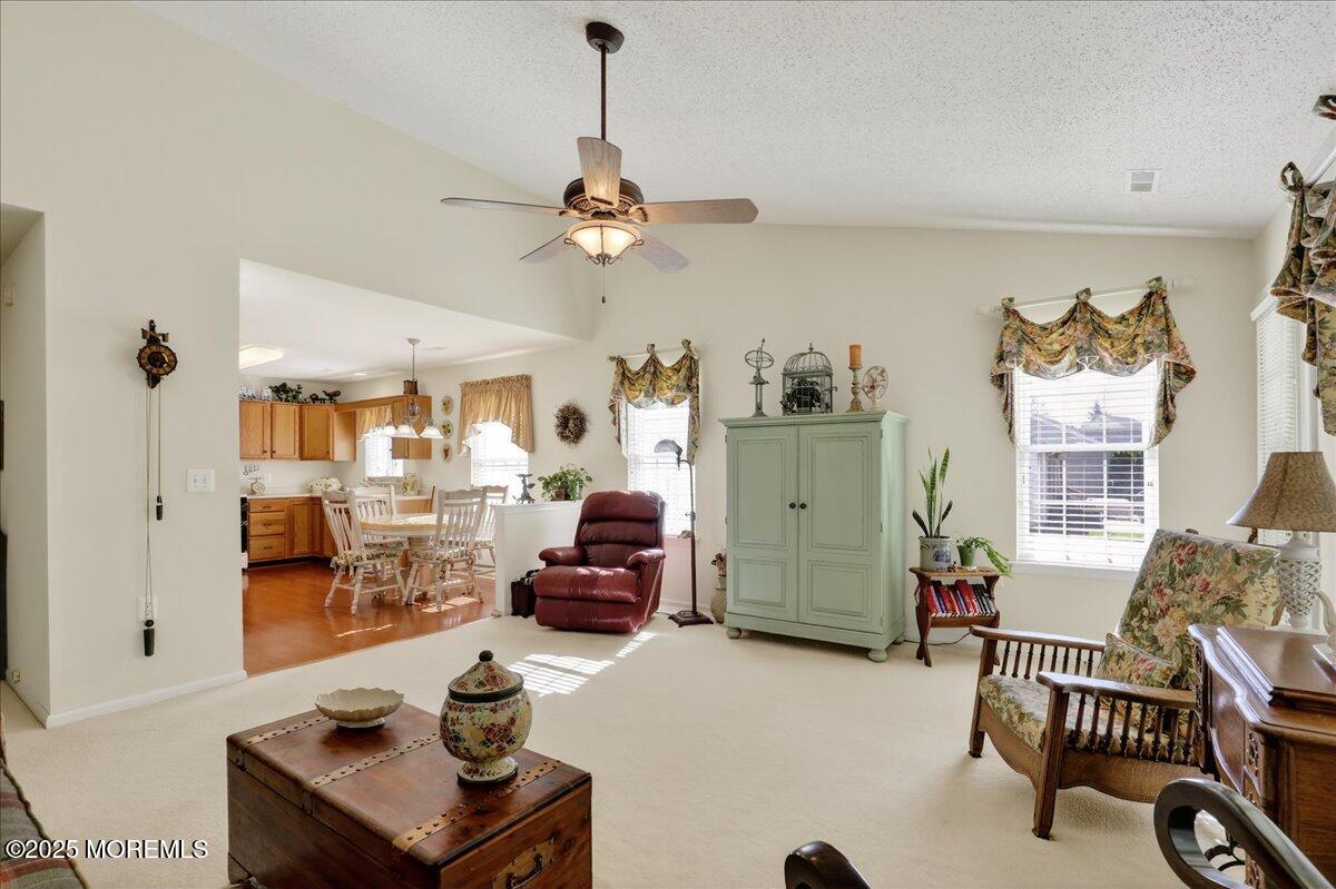 54 Merion Lane Jackson, NJ 08527 - Photo 19 of 46 a living room with furniture and a chandelier