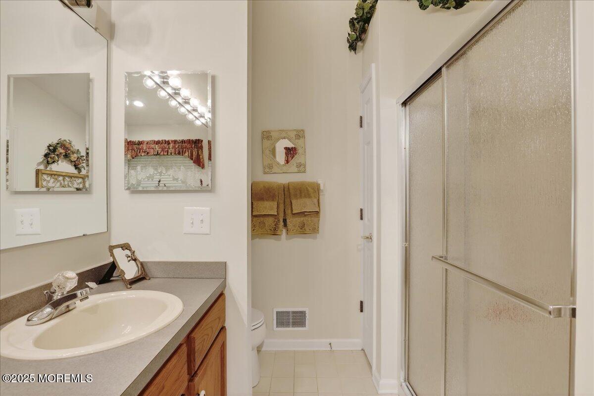 54 Merion Lane Jackson, NJ 08527 - Photo 26 of 46 a bathroom with a sink and a mirror