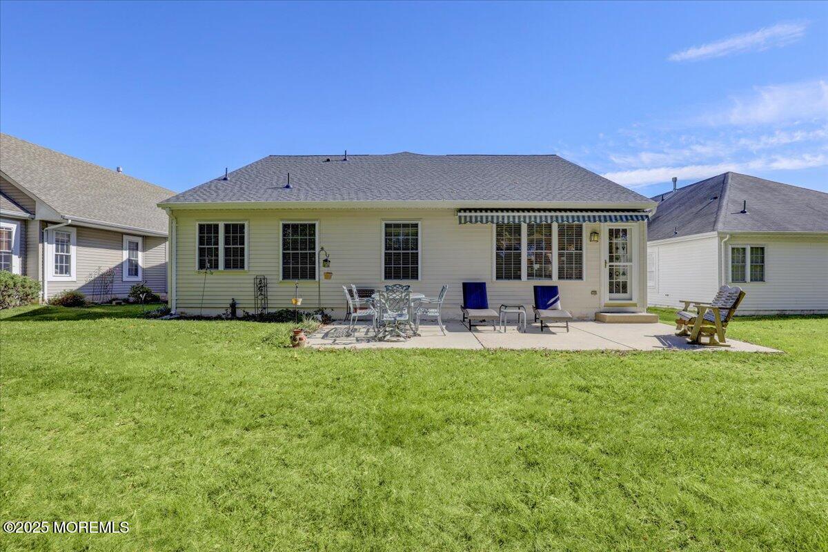 54 Merion Lane Jackson, NJ 08527 - Photo 31 of 46 a view of a house with a backyard and a patio