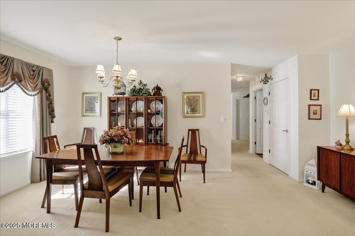 54 Merion Lane Jackson, NJ 08527 - Photo 8 of 46 a view of a dining room with furniture and chandelier