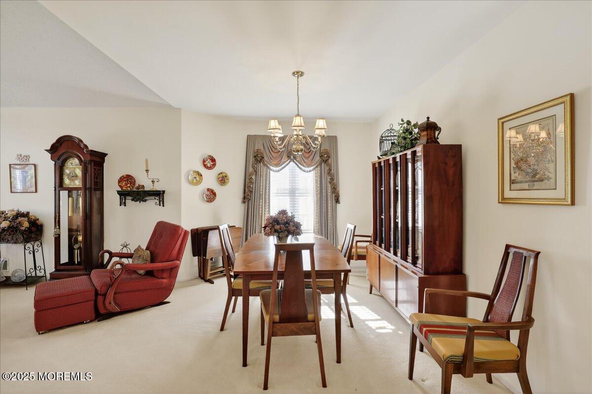 54 Merion Lane Jackson, NJ 08527 - Photo 9 of 46 a view of a dining room with furniture and chandelier