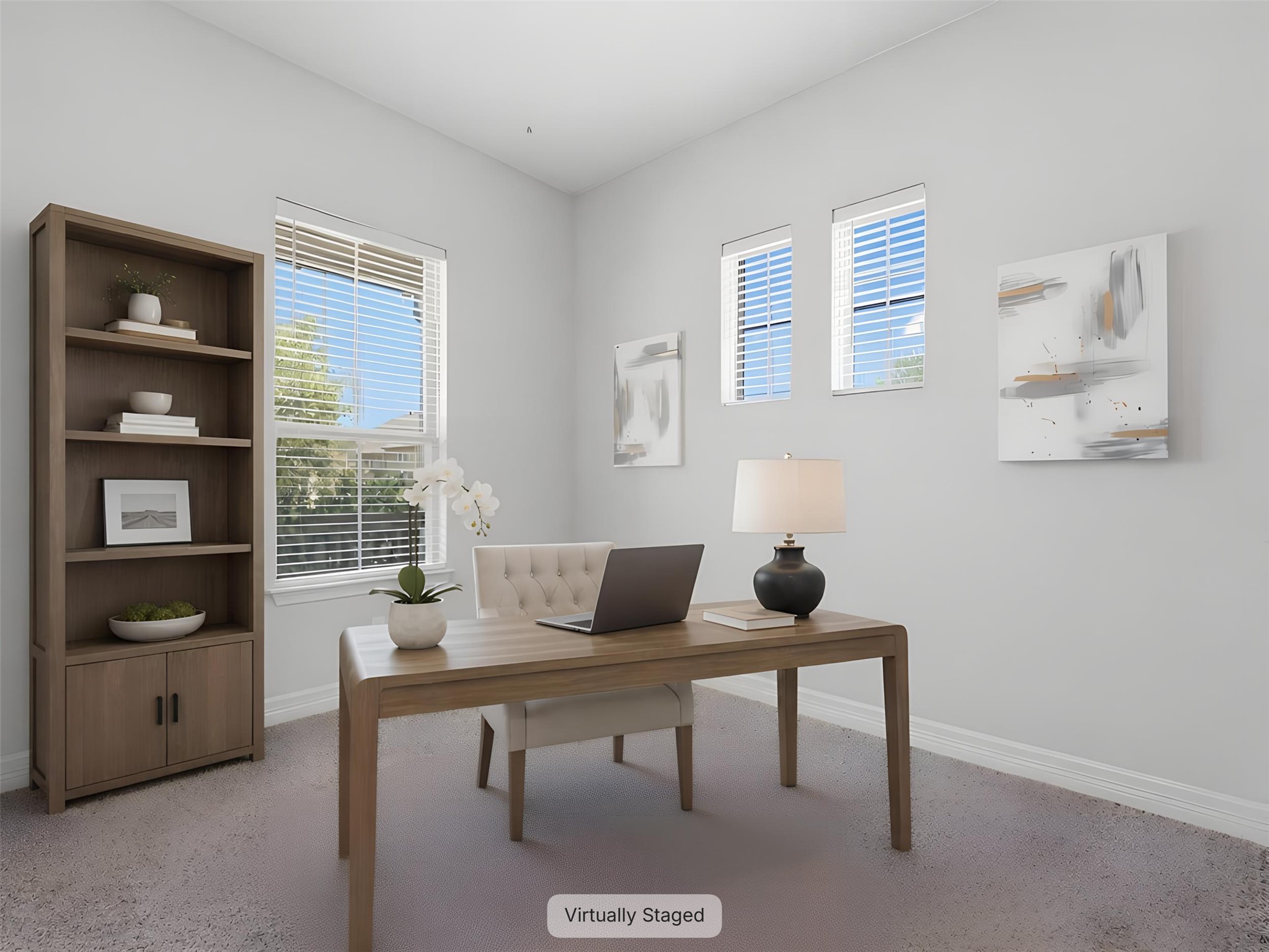 2132 Ringstaff Road Leander, TX 78641 - Photo 6 of 39 A well-lit study with ample window light and organized shelving creates an inviting workspace.