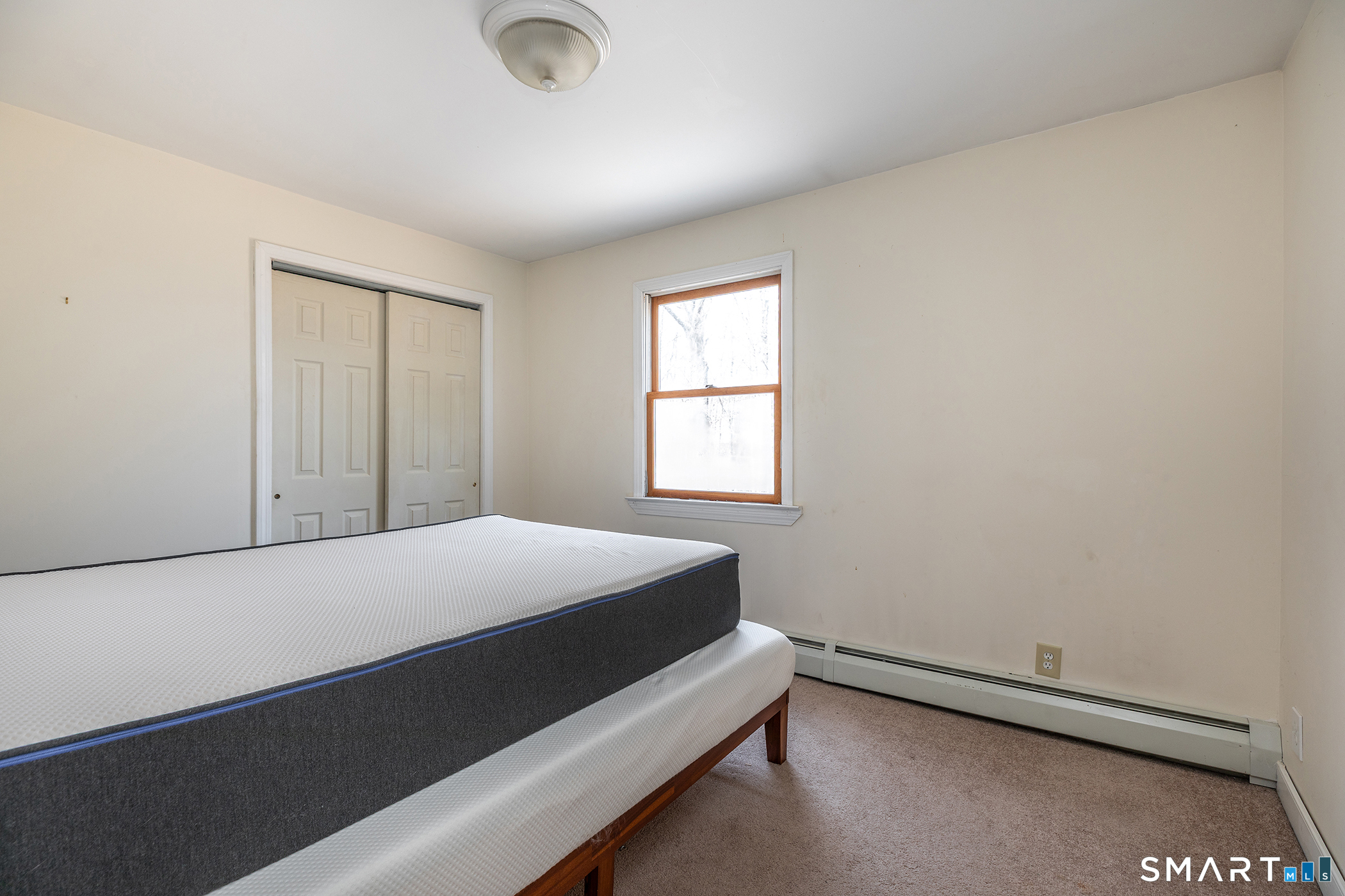 24 Hickory Lane Roxbury, CT 06783 - Photo 38 of 42 a bedroom with a bed and a window
