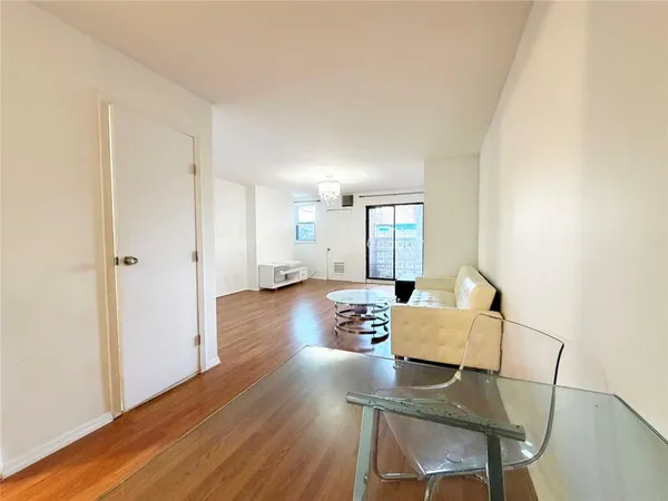 a view of a livingroom with furniture and wooden floor