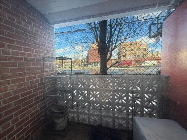 a bathroom with a sink toilet and window
