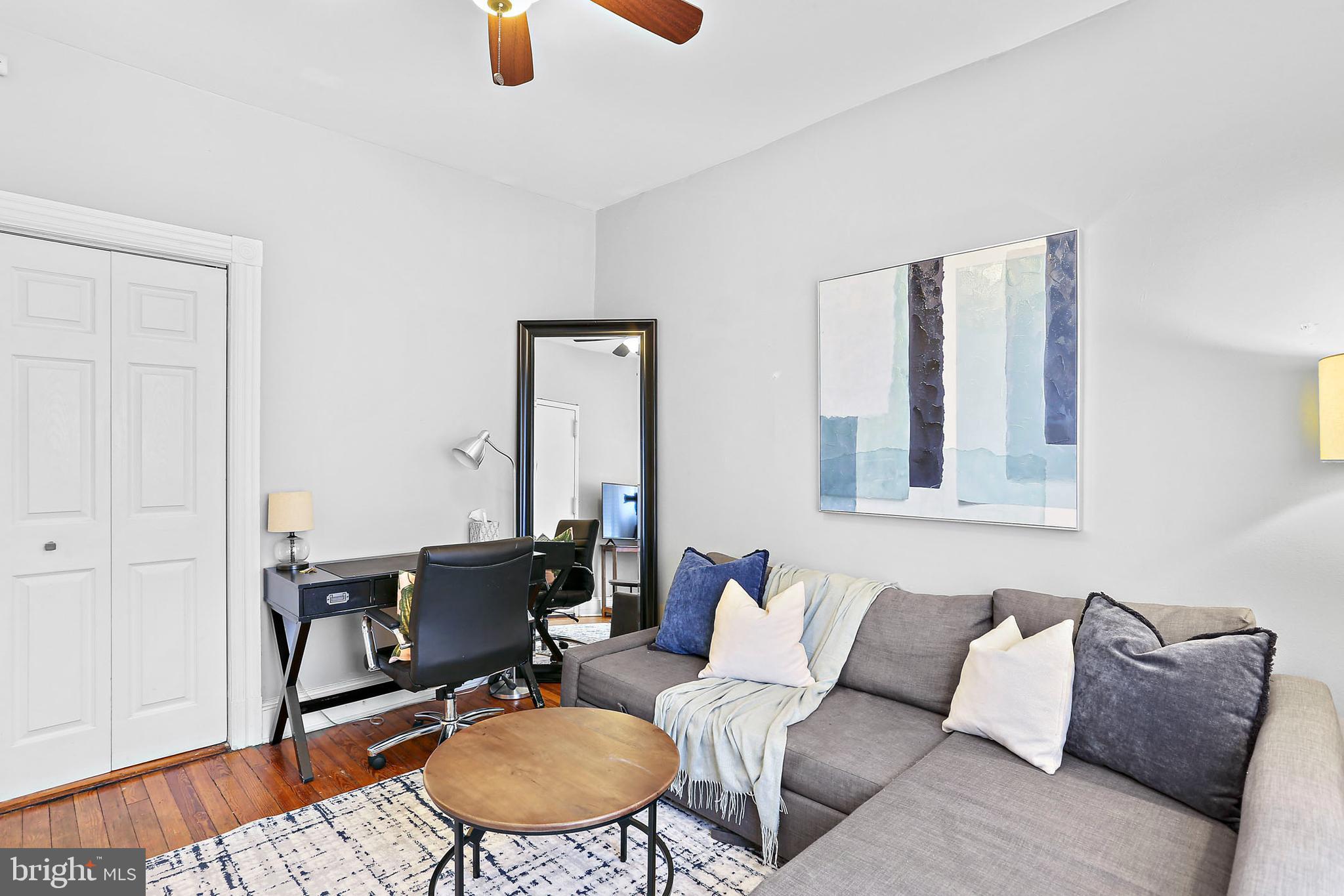 1211 33rd Street Northwest, Unit 1 Washington, DC 20007 - Photo 6 of 18 a living room with furniture