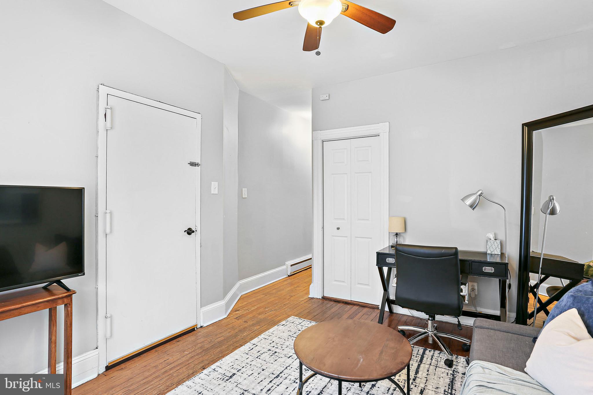 1211 33rd Street Northwest, Unit 1 Washington, DC 20007 - Photo 7 of 18 a view of a livingroom with furniture and a flat screen tv