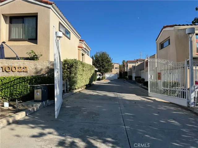 a view of a street with a building in the background