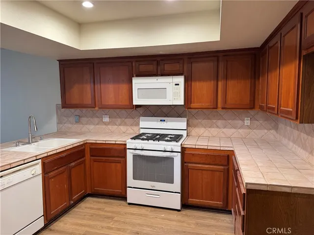 a kitchen with a stove and a sink