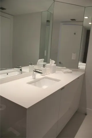 a bathroom with a sink and toilet