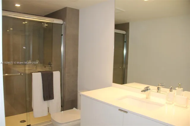 a bathroom with a bathtub and shower