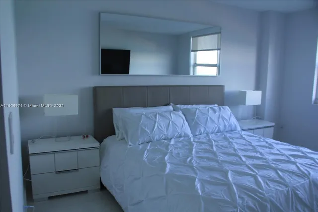 swimming pool view with a seating space