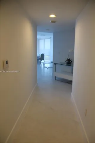 a bathroom with a double vanity sink and mirror