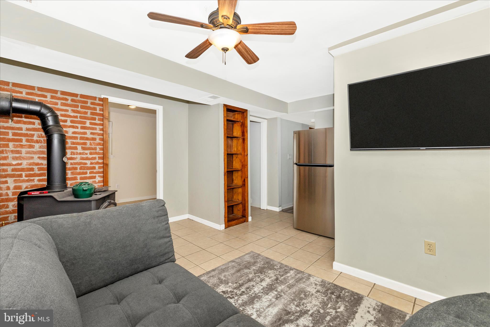 2235 Bowersox Road New Windsor, MD 21776 - Photo 23 of 35 a living room with furniture and a flat screen tv