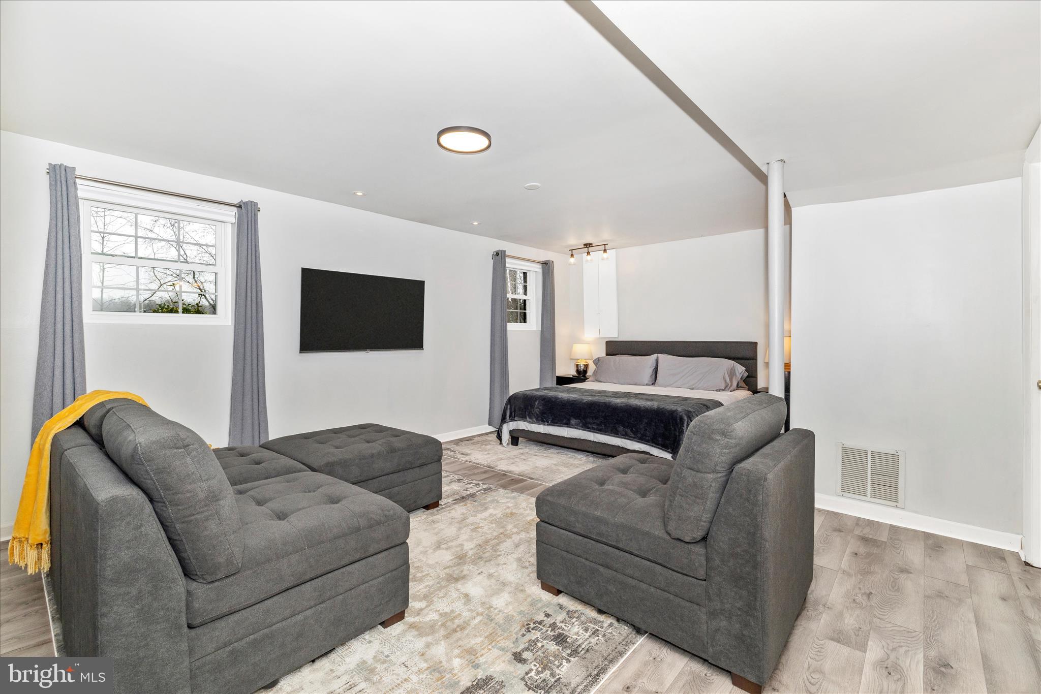 2235 Bowersox Road New Windsor, MD 21776 - Photo 24 of 35 a living room with furniture and a flat screen tv
