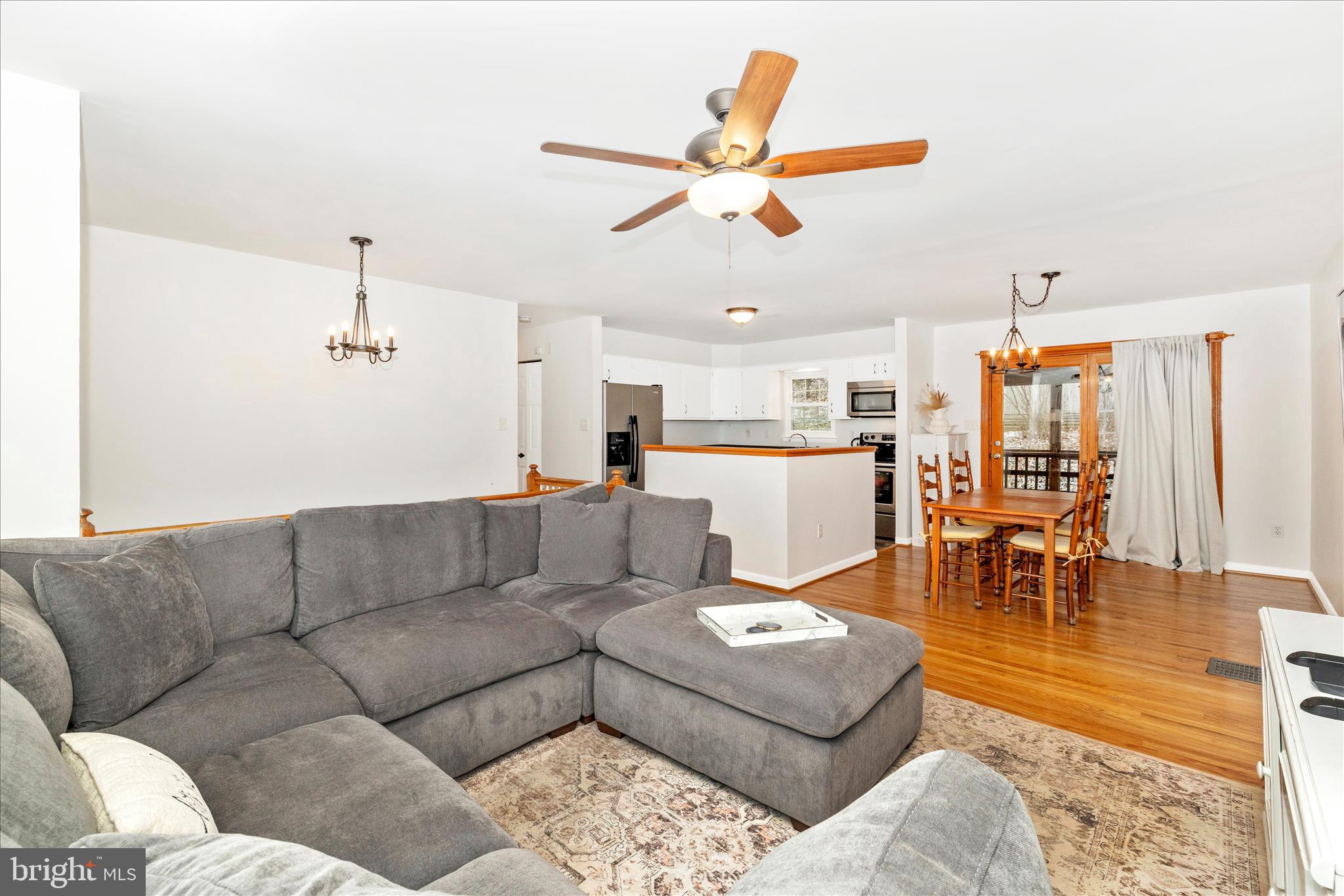 2235 Bowersox Road New Windsor, MD 21776 - Photo 6 of 35 a living room with furniture kitchen view and a chandelier