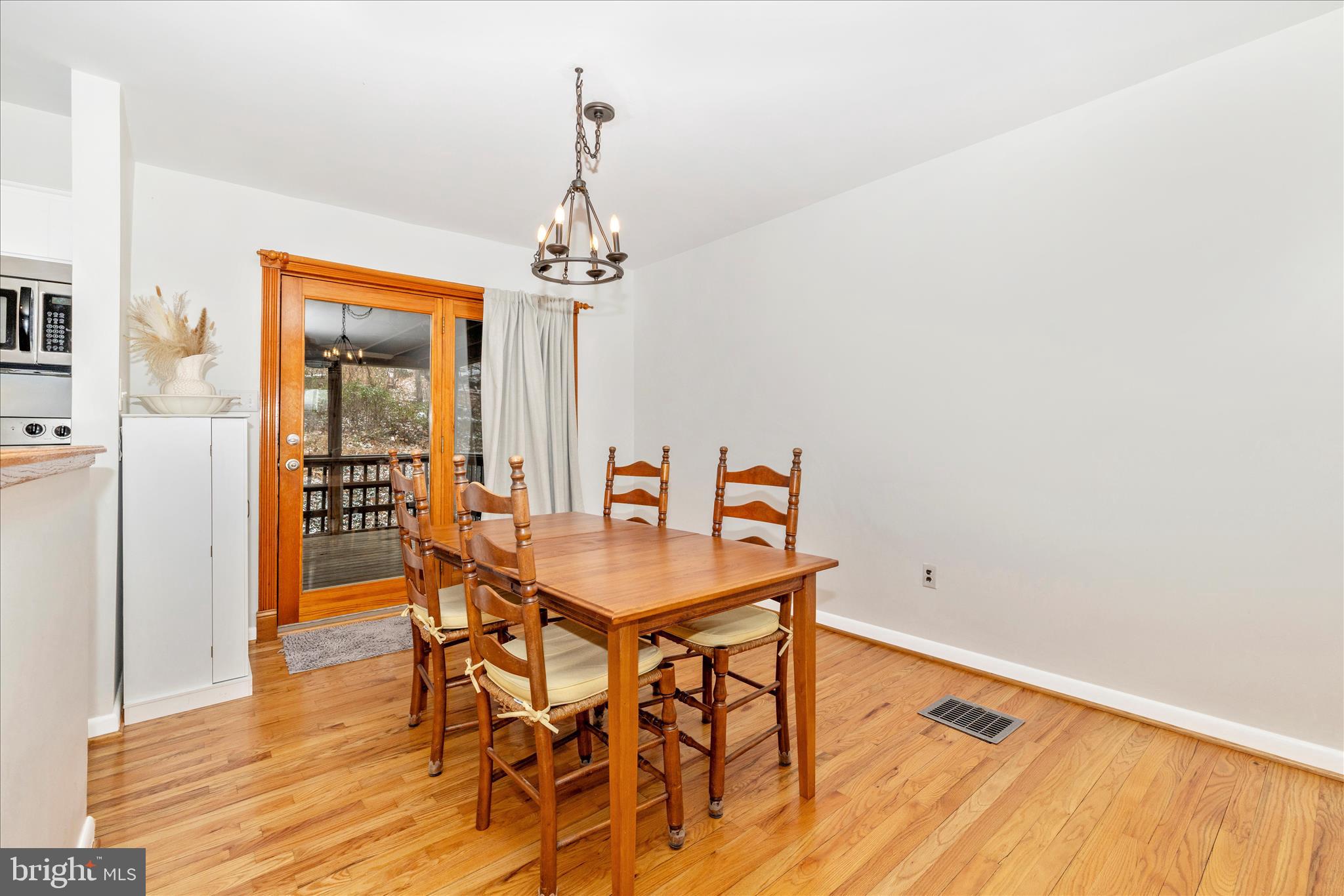 2235 Bowersox Road New Windsor, MD 21776 - Photo 7 of 35 a view of a dining room with furniture and wooden floor