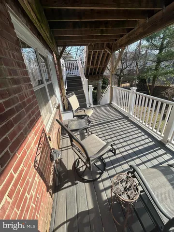 a view of balcony with wooden floor