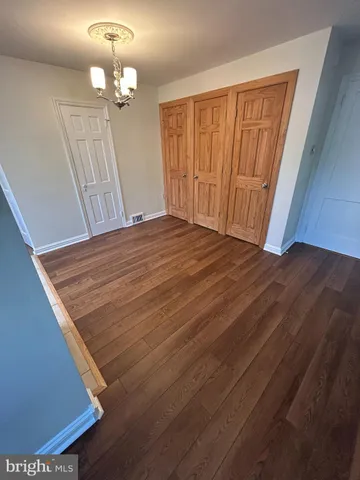 a view of a livingroom with wooden floor