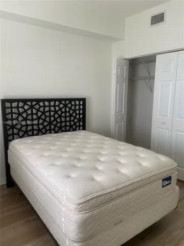 a bathroom with a granite countertop bathtub shower sink and toilet
