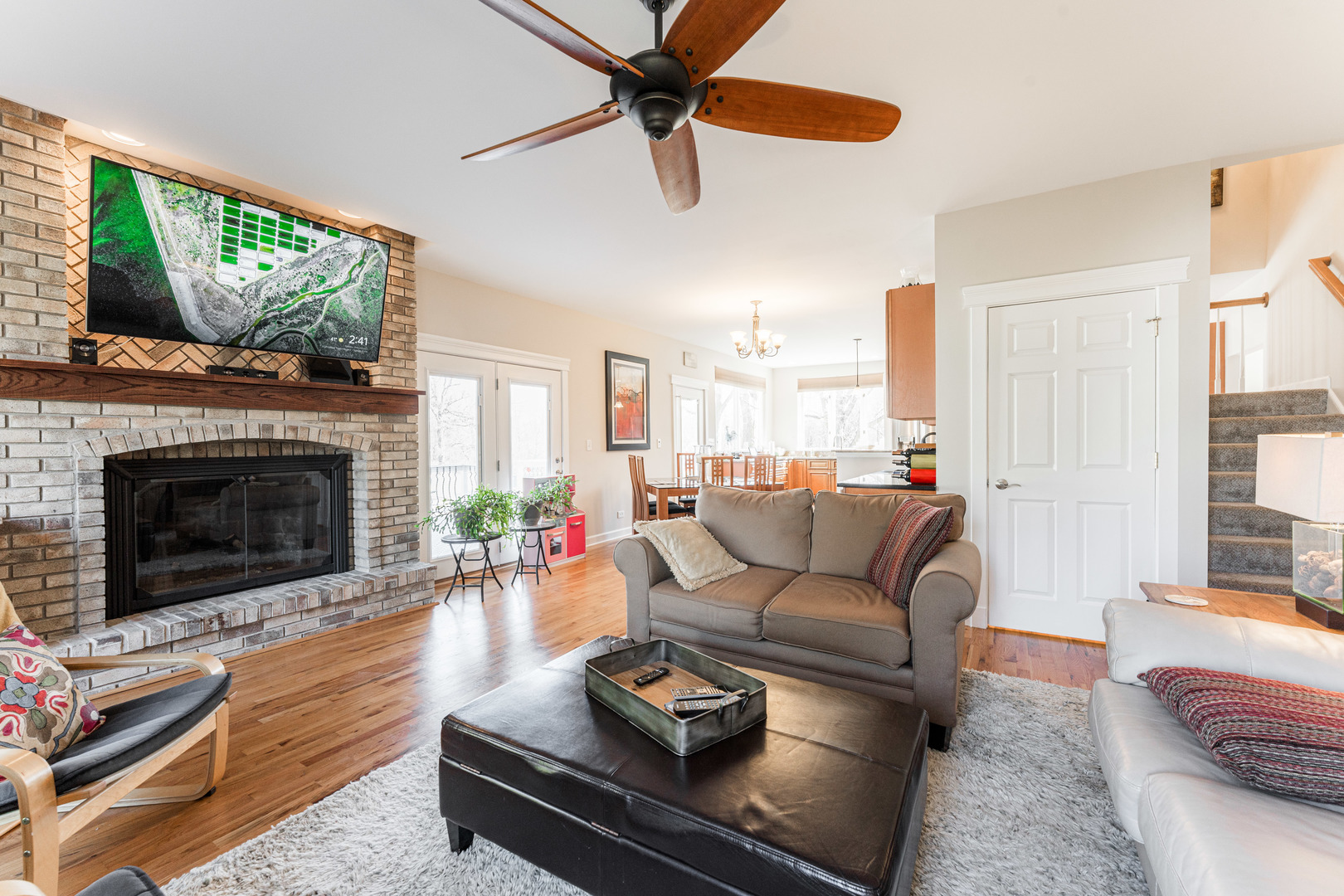 181 North Prince Crossing Road West Chicago, IL 60185 - Photo 13 of 62 a living room with furniture a flat screen tv and a fireplace