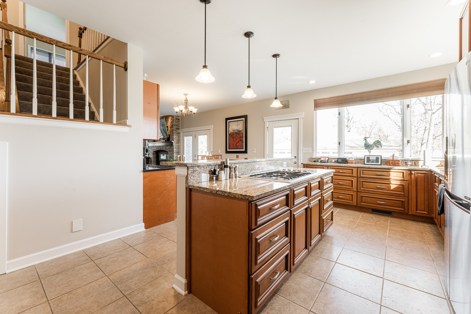 181 North Prince Crossing Road West Chicago, IL 60185 - Photo 17 of 62 a kitchen with stainless steel appliances granite countertop a stove and a large window